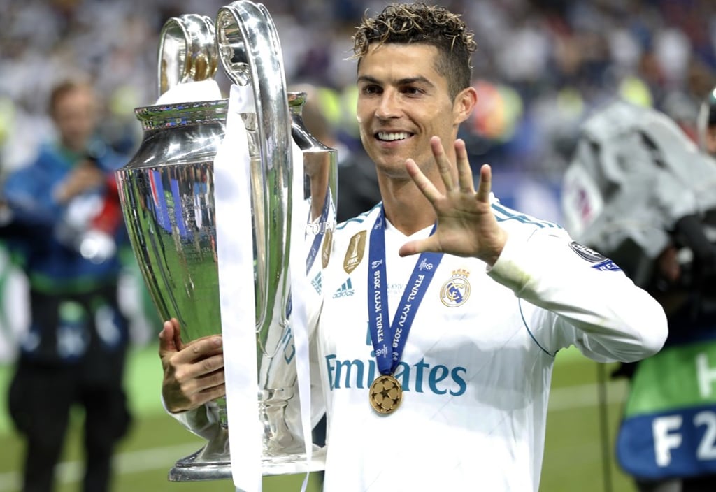 Cristiano Ronaldo celebrates with the trophy after winning the Champions League final against Liverpool. Photo: AP