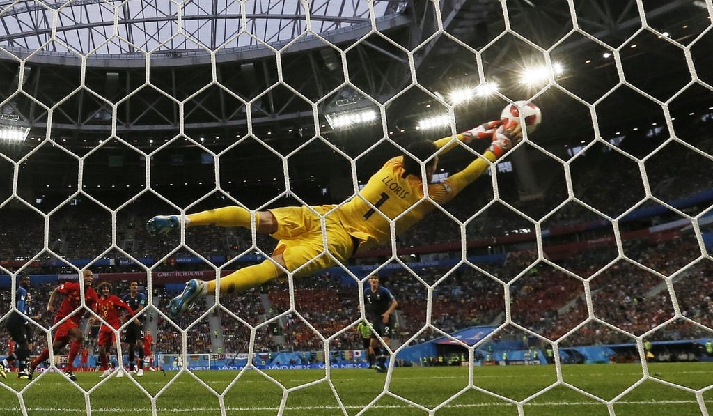 Hugo Lloris makes a flying save for France during the World Cup semi-final against Belgium. Photo: EPA