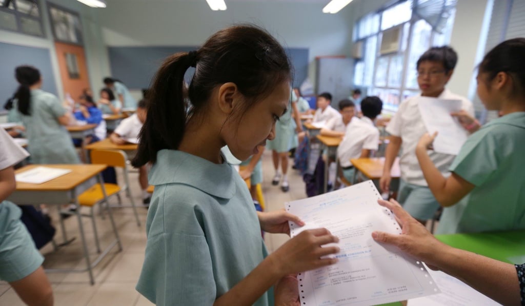 St Patrick School student Penny Tsoi Yan-yi, 12, was distraught after discovering she had been accepted by Hoi Ping Chamber of Commerce Secondary School, her third choice. Photo: Xiaomei Chen