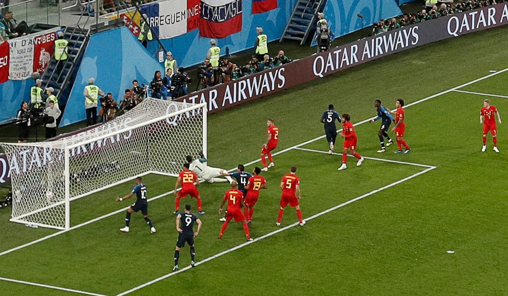 France’s Samuel Umtiti (5) wheels away after putting his team in front in the World Cup semi-final against Belgium. Photo: AFP
