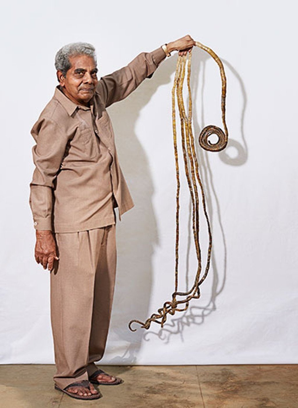 Shridhar Chillal from Pune, India. His nails took 66 years to grow. Photo: Guinness World Records Shridhar Chillal from Pune, India. His nails took 66 years to grow. Photo: Guinness World Records