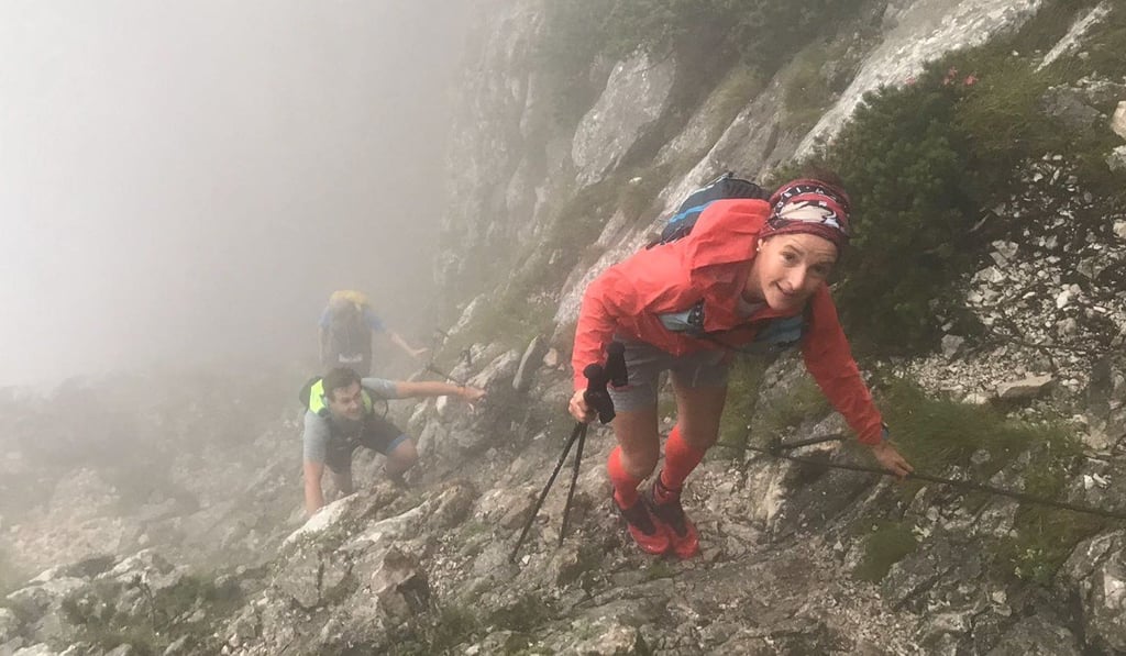 Esther Roling ascends a near-vertical slope in the mist, more akin to rock climbing than trail running. Photo: Handout