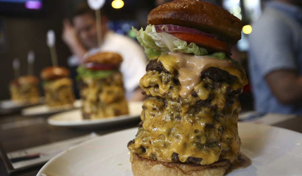Competitors ate a burger with eight patties at Burger Joys over the weekend. Photo: Jonathan Wong