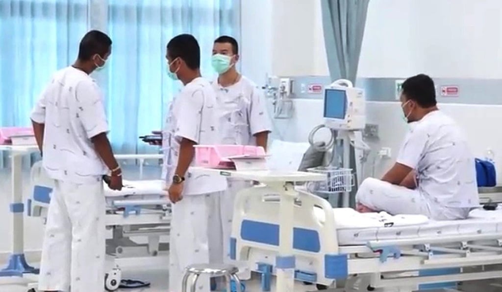 A photo made available by the Thai government public relations department (PRD) shows the last four of the Thai Navy Seal members, who stayed with the youth soccer team and their assistant coach inside a cave until they all were rescued, as they are being treated at hospital. Photo: PRD via EPA-EFE
