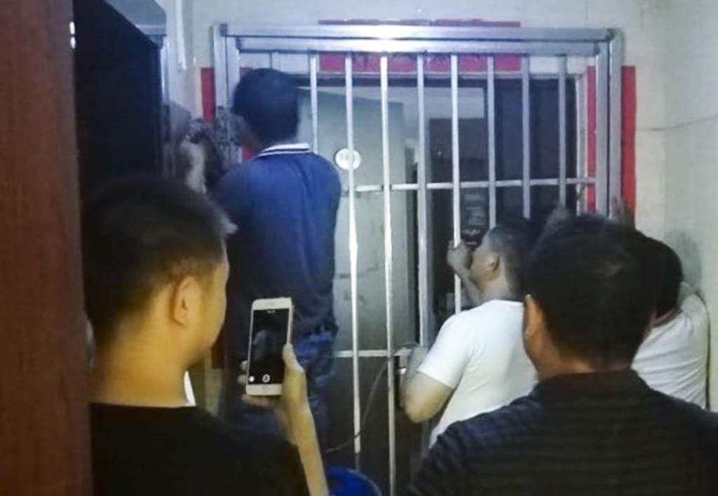 The security gates were unlocked only after the Unirule workers called the police. Photo: Unirule Institute of Economics