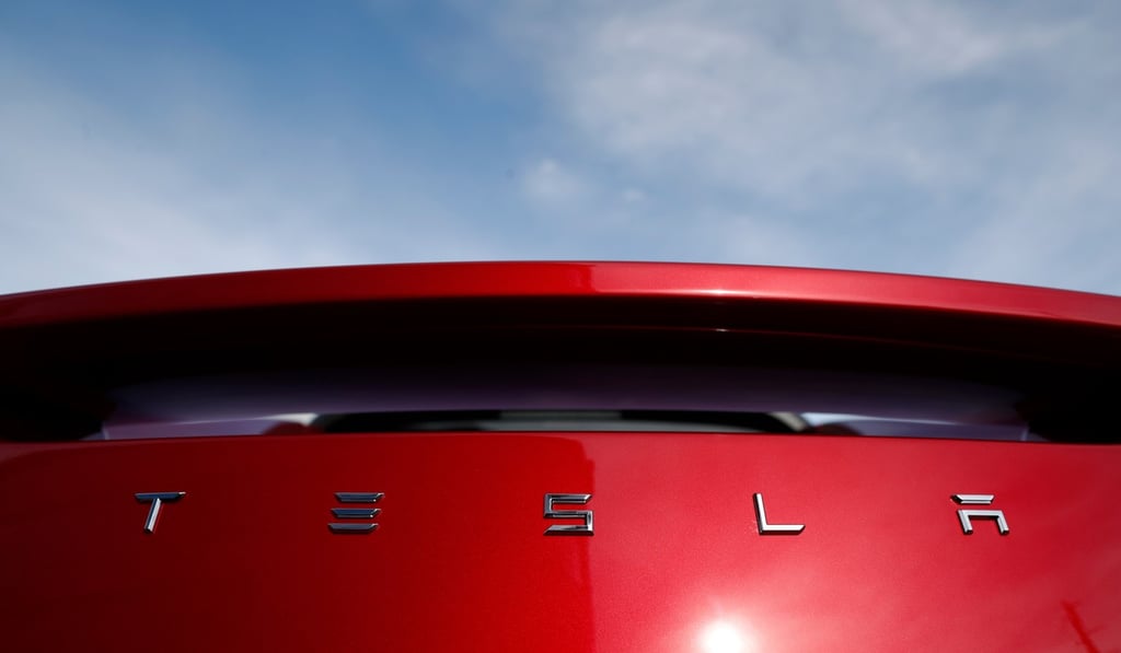 The rear of a Tesla roadster on a dealer's lot in June. Photo: AP The rear of a Tesla roadster on a dealer's lot in June. Photo: AP