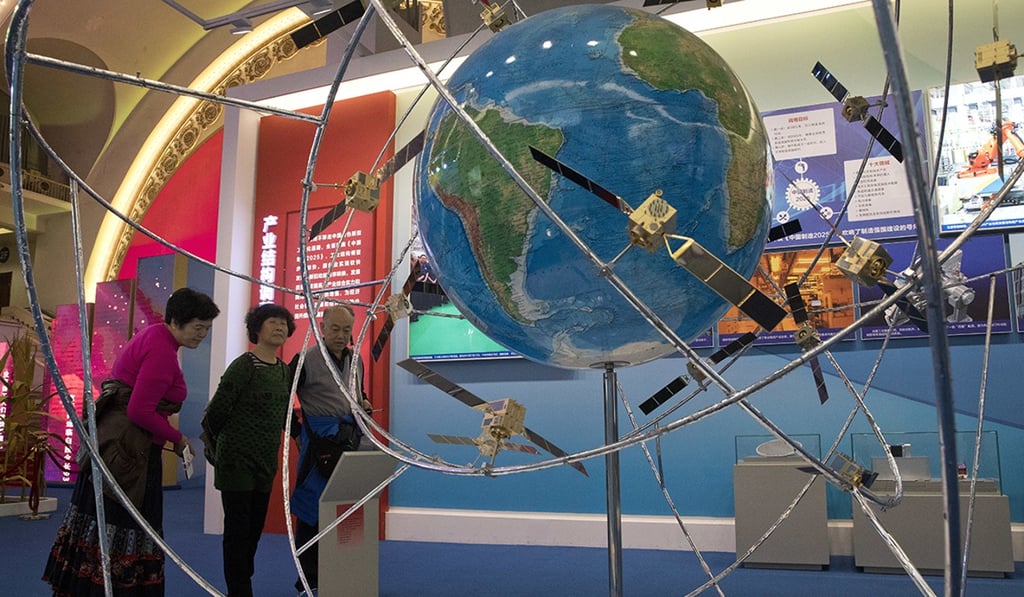 An exhibition showing China's satellite achievements under five years of Xi's leadership in Beijing. Photo: AP