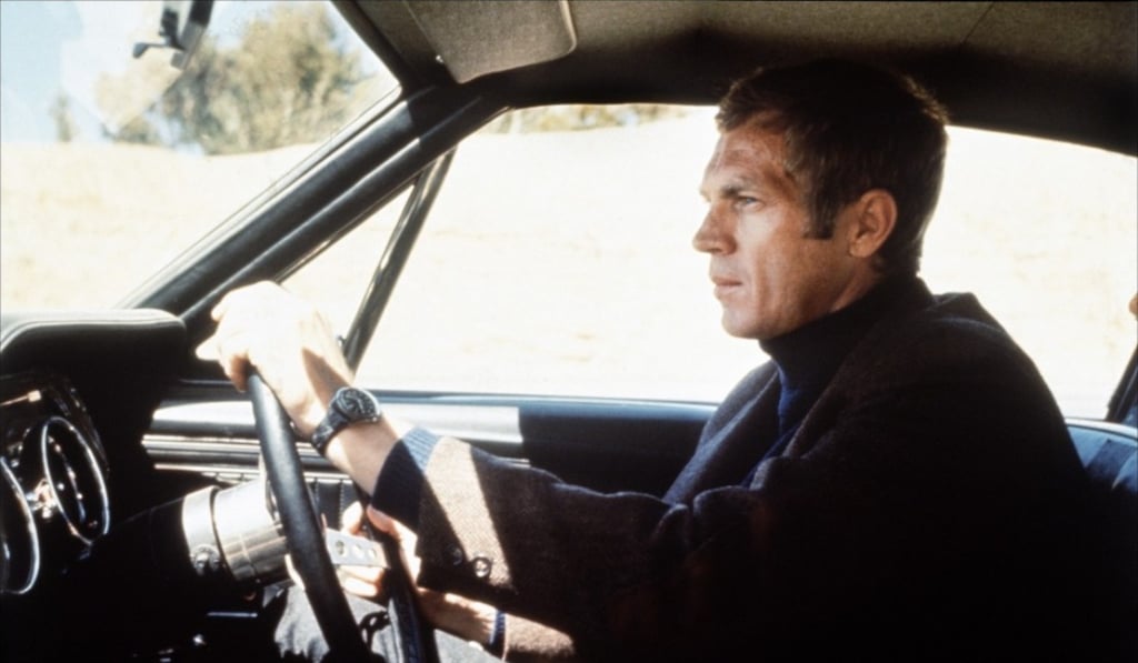 Steve McQueen at the wheel of a Ford Mustang GT in Bullitt.
