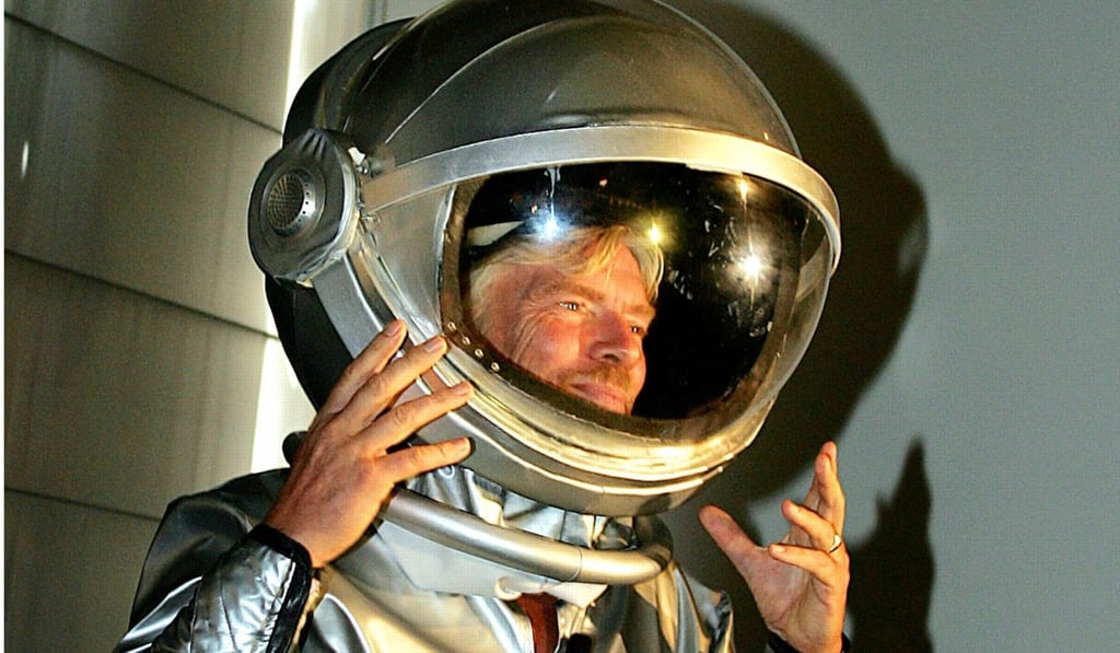 This 2005 file photo shows Richard Branson arriving in a spacesuit for the announcement of Australia's first private astronauts to sign up for the Virgin Galactic flights into space. The flights are months away from reality. Photo: Agence France-Presse