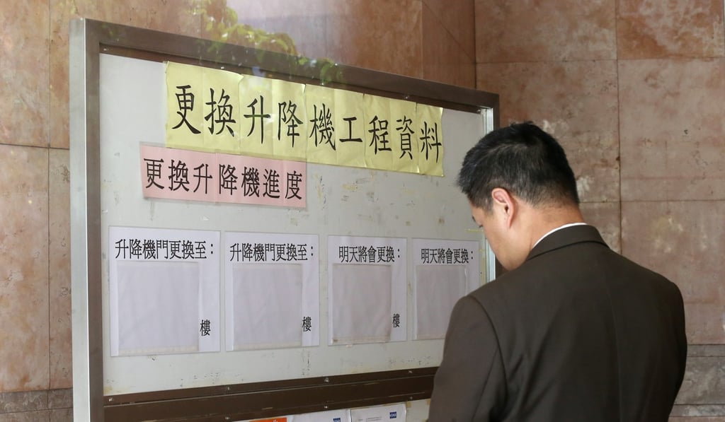 A resident studies a notice board in Waterside Plaza. Photo: Dickson Lee