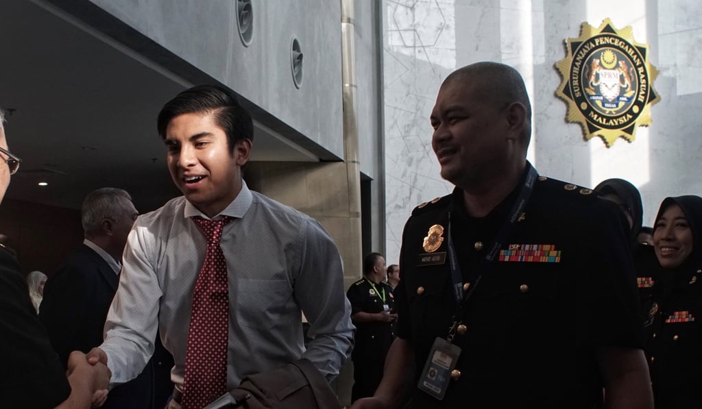 Syed Saddiq Syed Abdul Rahman, left, was criticised for not defending a gay staffer. Photo: Bloomberg