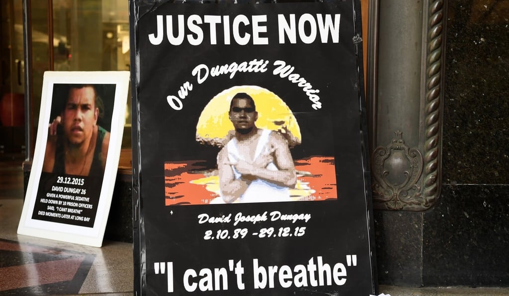 Banners outside Downing Centre Court in Sydney. Photo: EPA