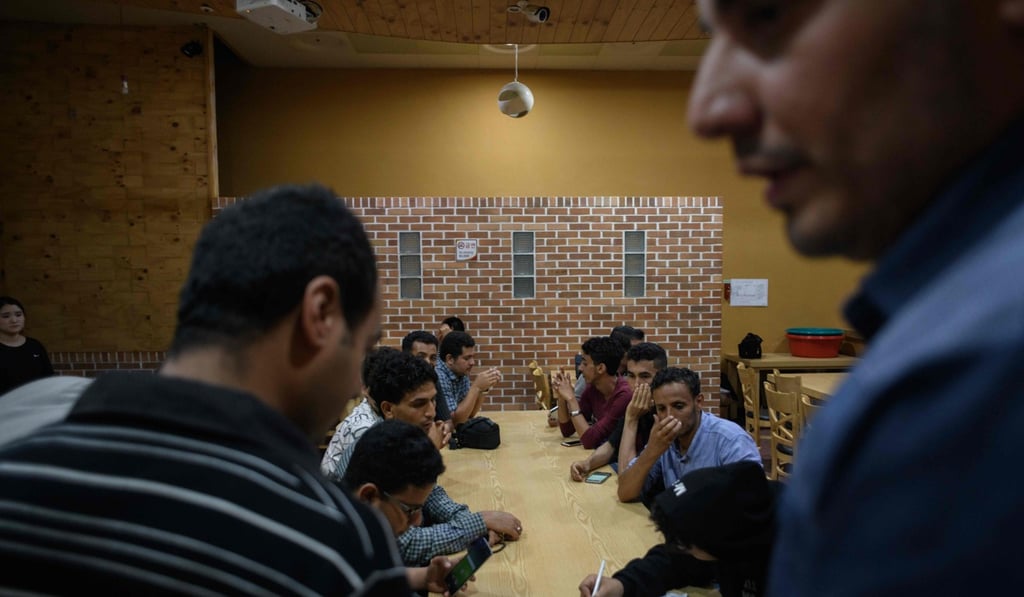 Yemeni asylum seekers gather at a hotel in Jeju, to list their names for assisted accommodation. Yemeni asylum seekers gather at a hotel in Jeju, to list their names for assisted accommodation.