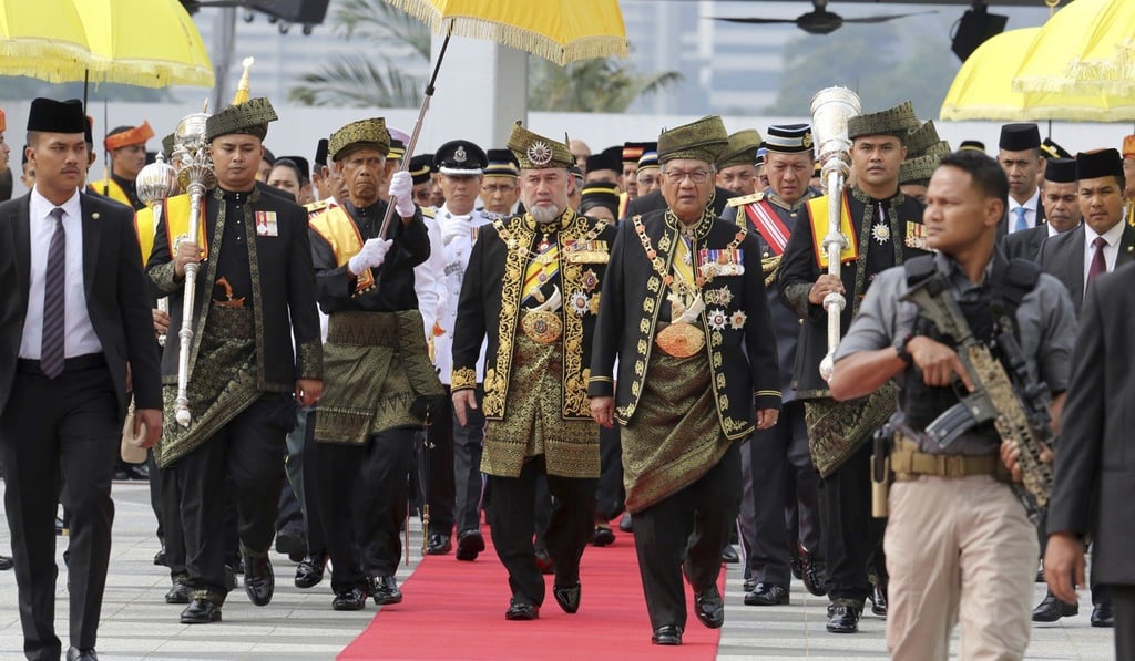 Malaysia King Sultan Muhammad V walking to parliament. Photo: AP Malaysia King Sultan Muhammad V walking to parliament. Photo: AP