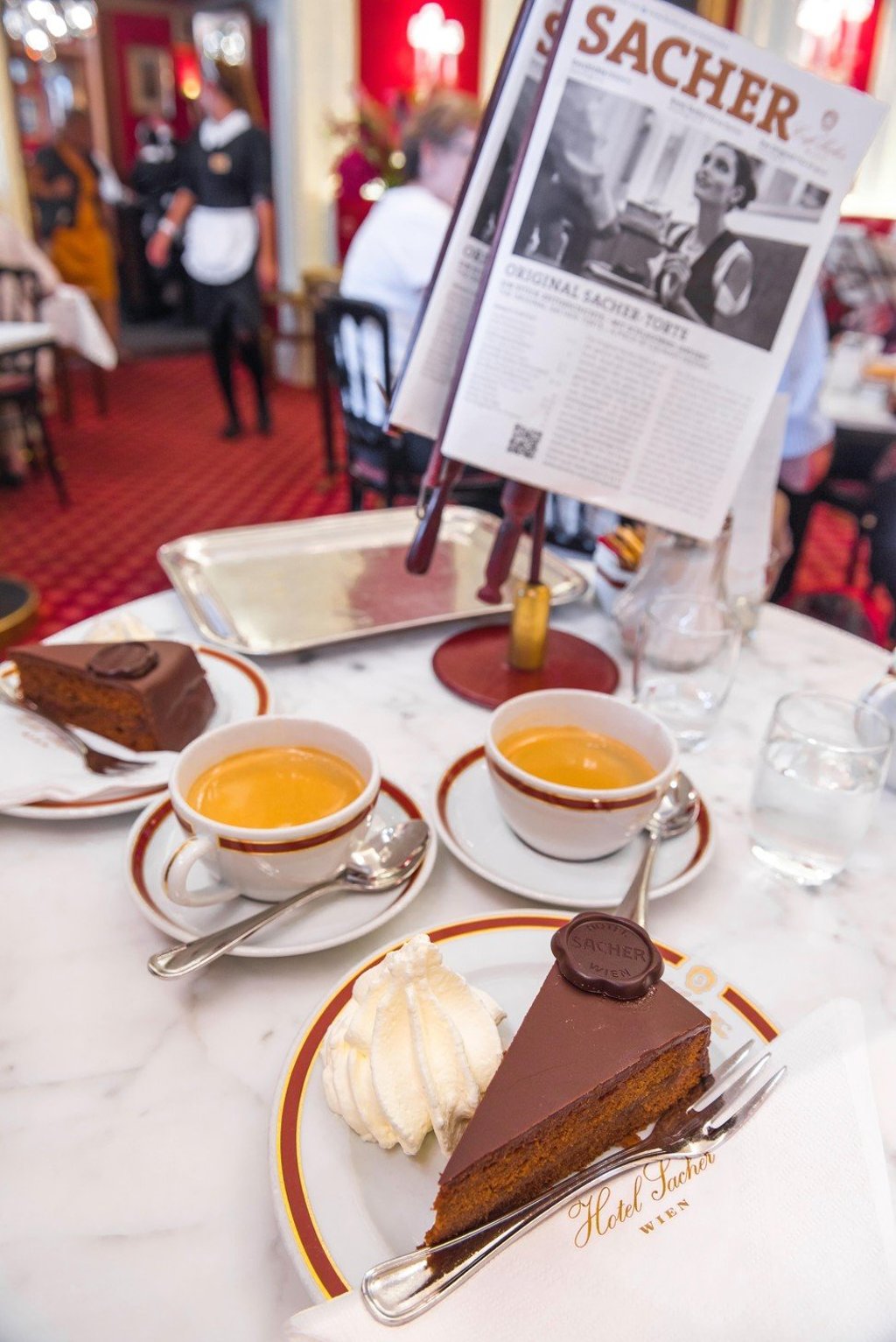 Sachertorte is a chocolate cake with hints of apricot jam, served with whipped cream. Photo: Alamy