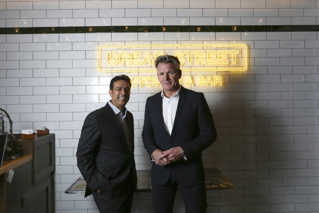 Celebrity chef Gordon Ramsay poses with Dining Concepts managing director Sandeep Sekhri at the 2014 opening of Bread Street Kitchen, in Lan Kwai Fong, on Hong Kong Island. Photo: Jonathan Wong
