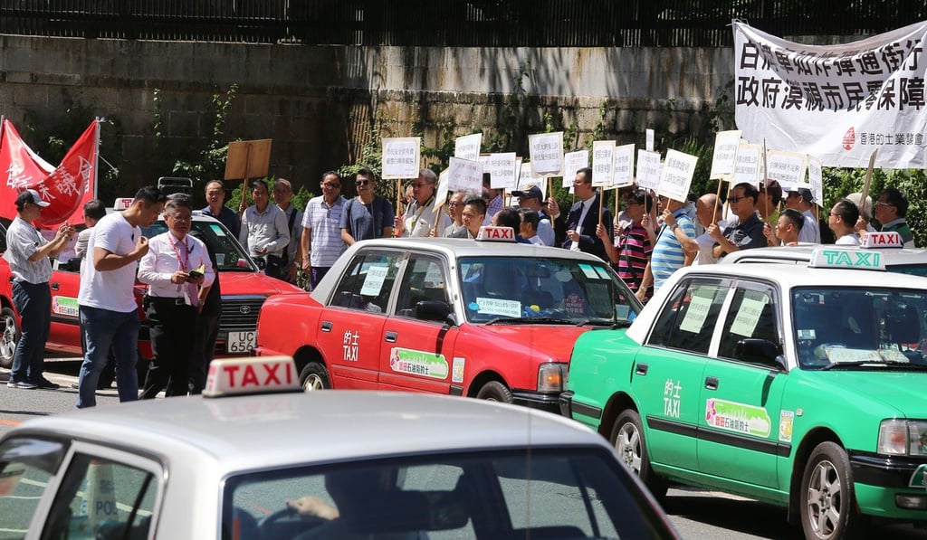 Members of the Hong Kong Taxi Council stage a demonstration in Central. Photo: Dickson Lee
