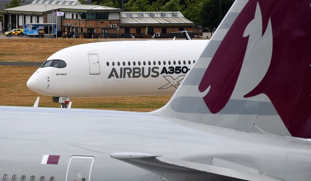 An Airbus A350-1000 XWB taxis behind a Boeing 777-300 from Qatar Airways during the Farnborough air show near London on Tuesday. Photo: EPA