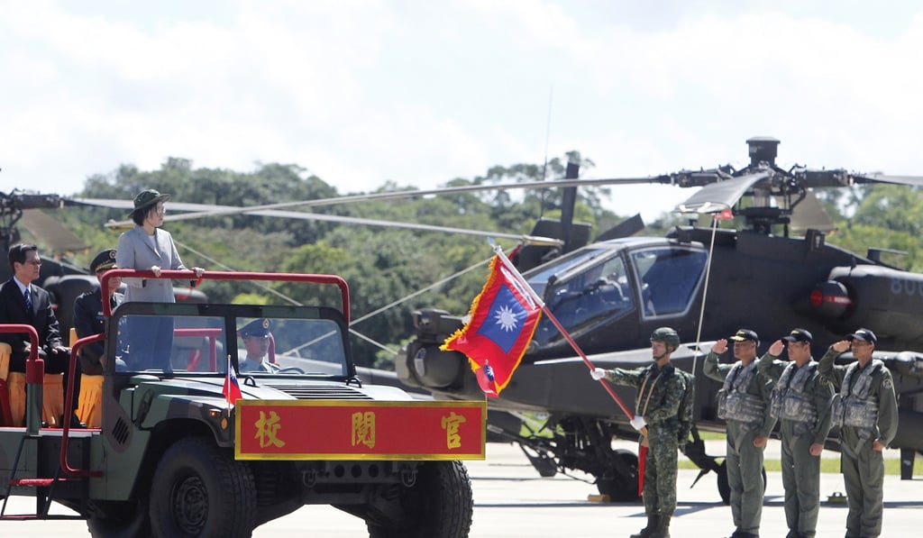 Tsai Ing-wen, standing in jeep, during the commissioning ceremony for the Apache attack helicopter squadron. Photo: AP