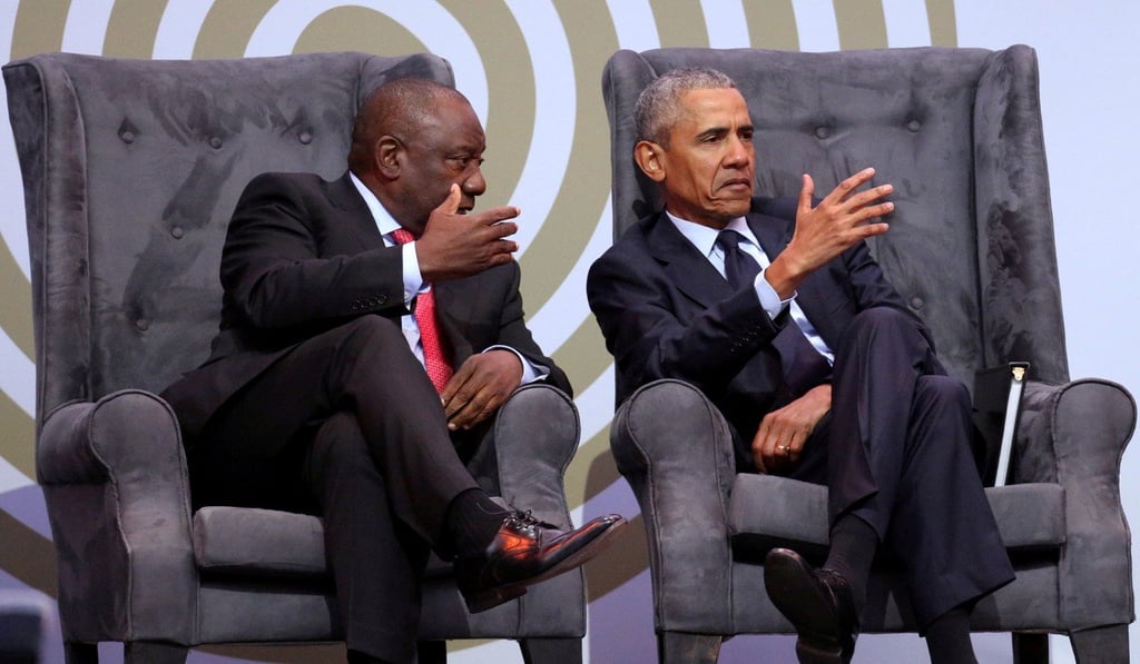 South African President Cyril Ramaphosa talks to former US President Barack Obama at the 16th Nelson Mandela annual lecture, marking the centenary of the anti-apartheid leader's birth, in Johannesburg. Photo: Reuters
