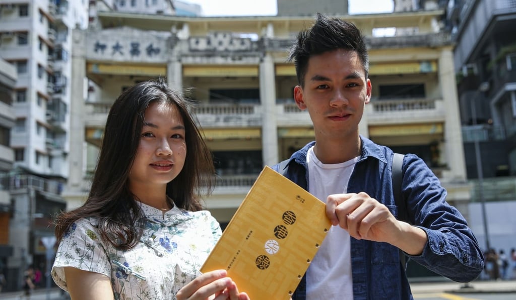 (From left) Haidee Or Hoi-yee and Godfrey Lai Sin-Huang showing their book. Photo: Edward Wong