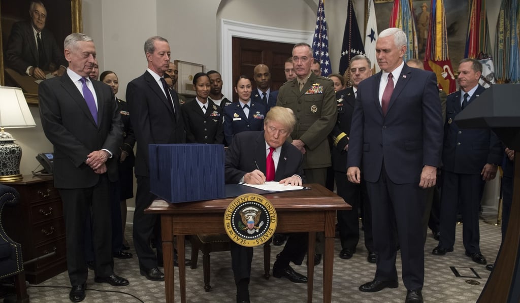 Donald Trump signs the National Defence Authorisation Act. Photo: AFP