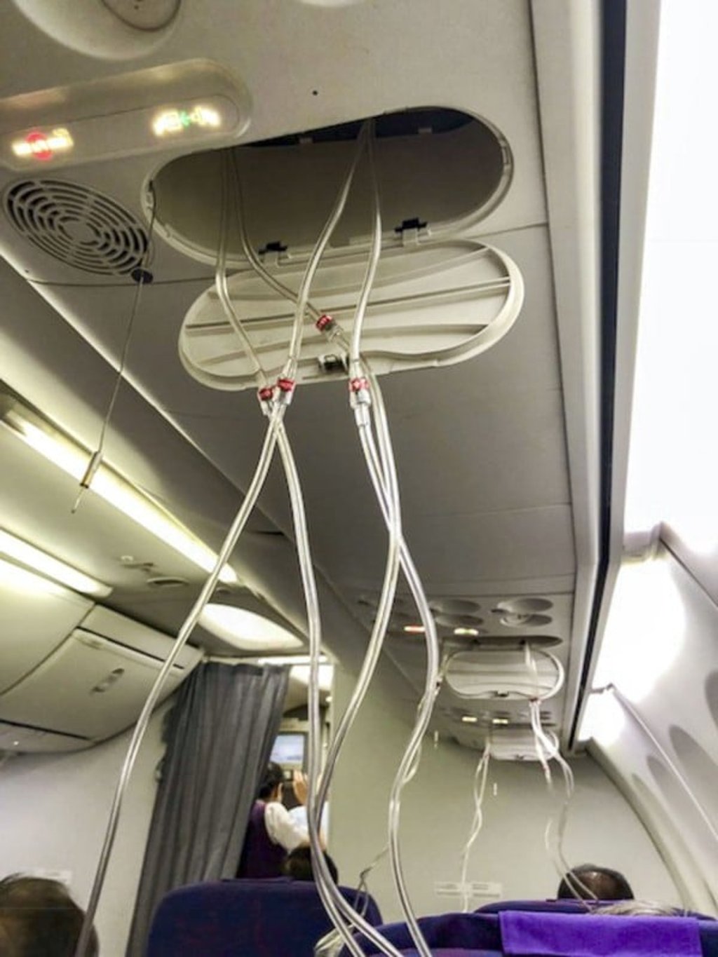 Oxygen masks on Air China flight CA106 from Hong Kong to Dalian. Photo: Eugene Chow