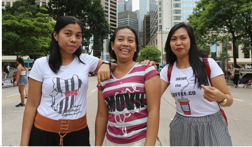 Melissa Masula is flanked by friends Clarisa Merca (left) and Jenelyn Berte. Photo: Dickson Lee