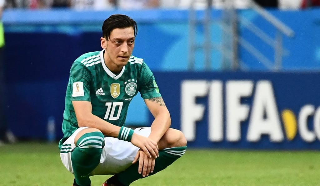 Ozil slumps to the turf after South Korea’s Son Heung-min scores in added time. Photo: AFP