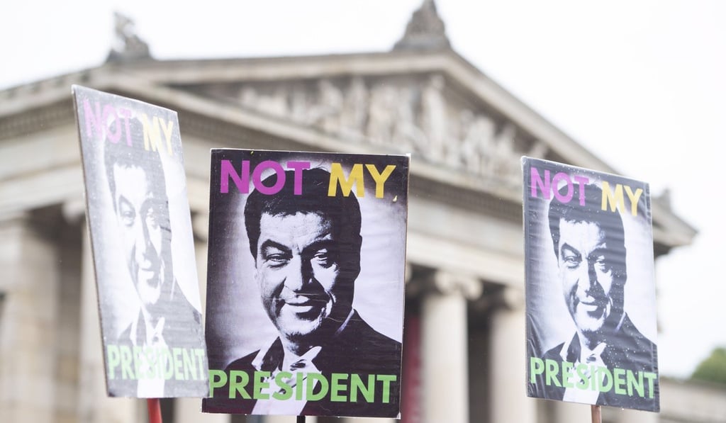 Placards with a picture of Bavarian Prime Minister Markus Soeder are shown during a demonstration in Munich against right-wing politics. Photo: EPA/EFE Placards with a picture of Bavarian Prime Minister Markus Soeder are shown during a demonstration in Munich against right-wing politics. Photo: EPA/EFE