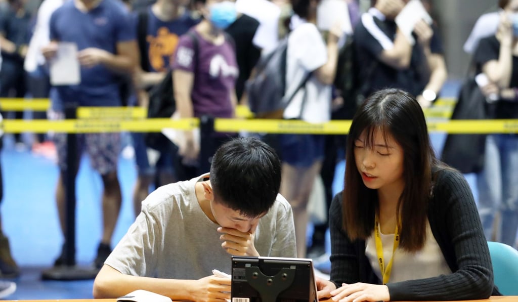 A fan goes through the registering process at the MacPherson Stadium in Mong Kok to get his hands on an early bird ticket to Hong Kong’s Ani-Com. Photo: Nora Tam
