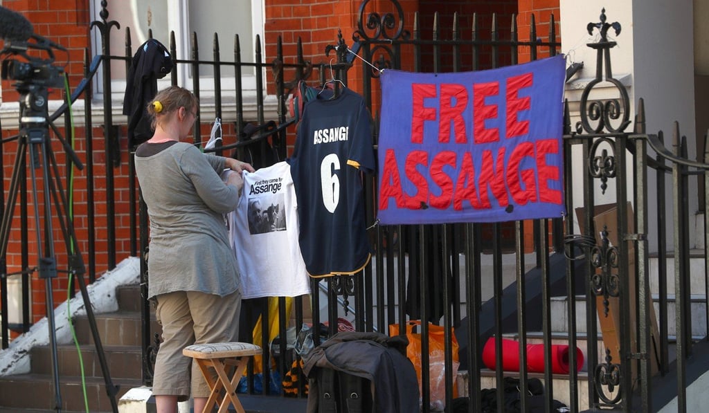 Julian Assange’s supporters place messages of support on railings around the Ecuadorean embassy in London. Photo: Reuters