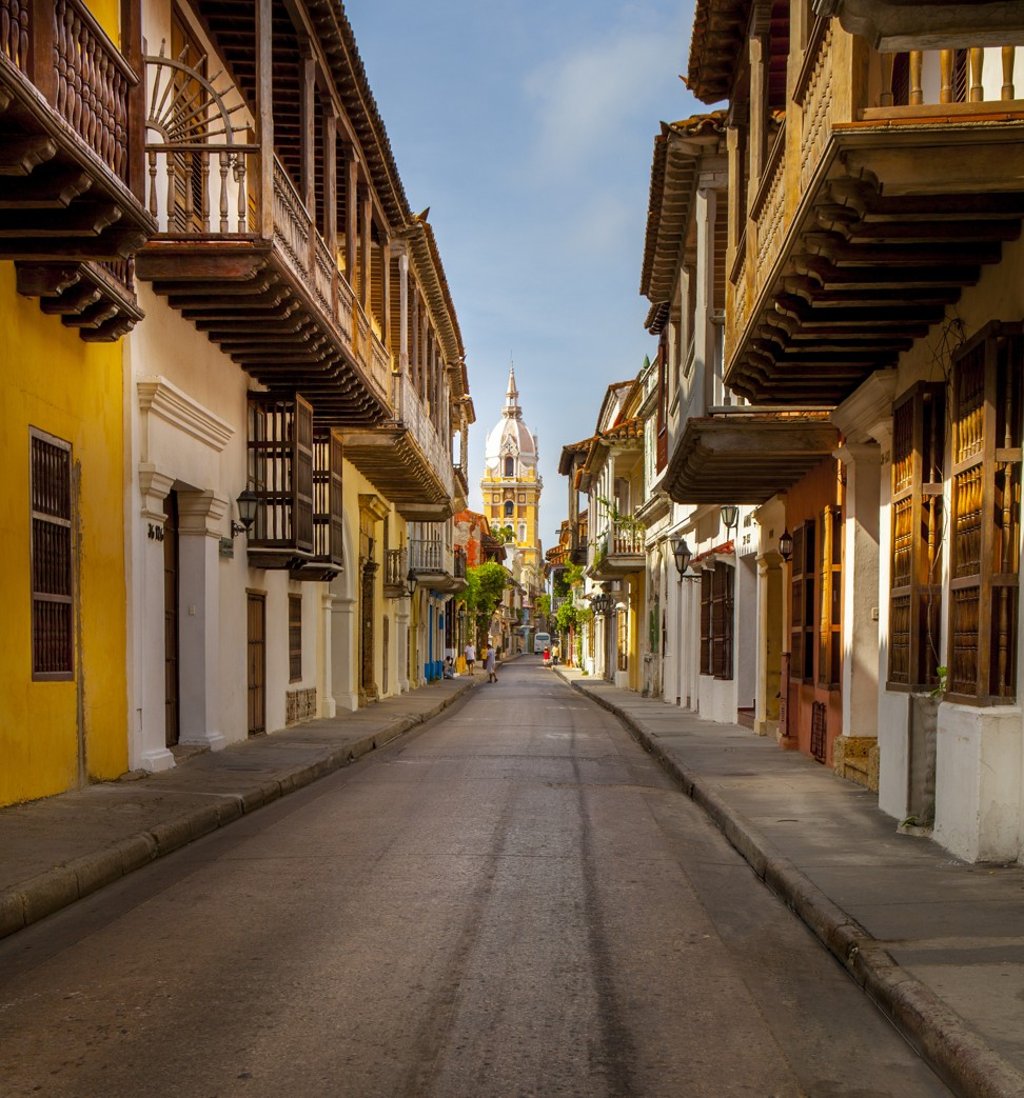 A charming narrow street in the old Spanish city of Cartagena, in Colombia.