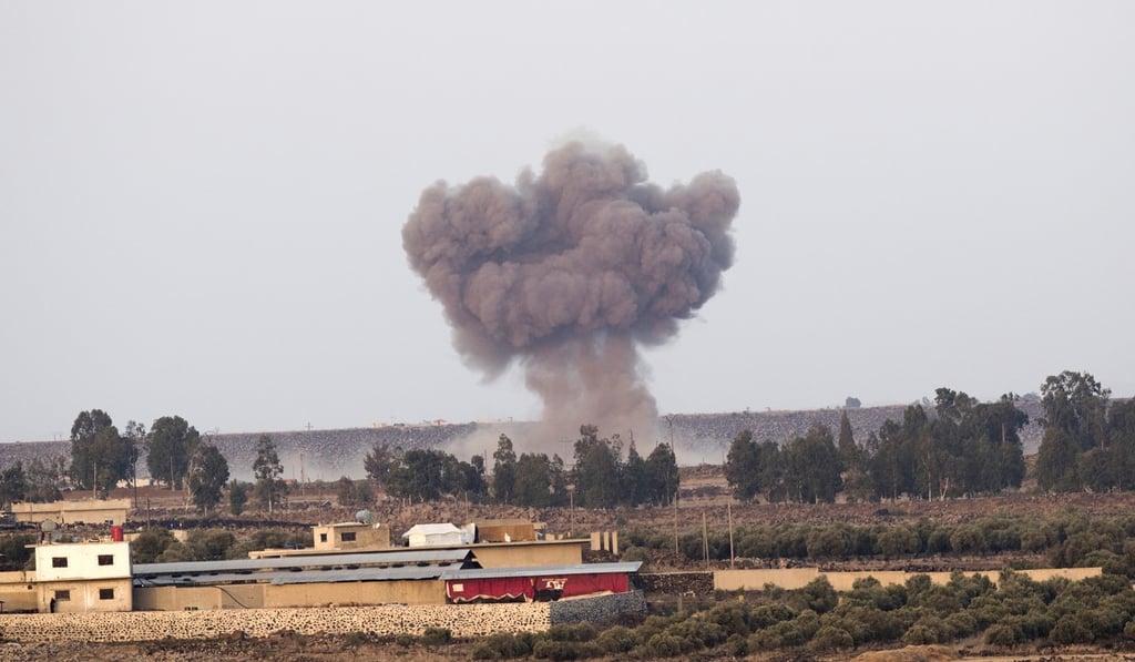 Smoke rises as a result of air strikes on the Syrian side of Golan Heights as seen from the Israeli side of the border on Tuesday. Photo: EPA-EFE