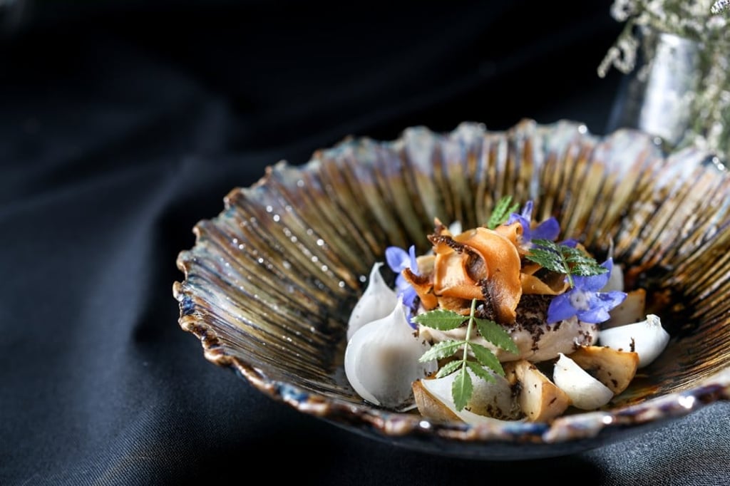 A vegan dish featuring mushrooms, onions, peanuts and dried olives served at Haku in Tsim Sha Tsui. A vegan dish featuring mushrooms, onions, peanuts and dried olives served at Haku in Tsim Sha Tsui.