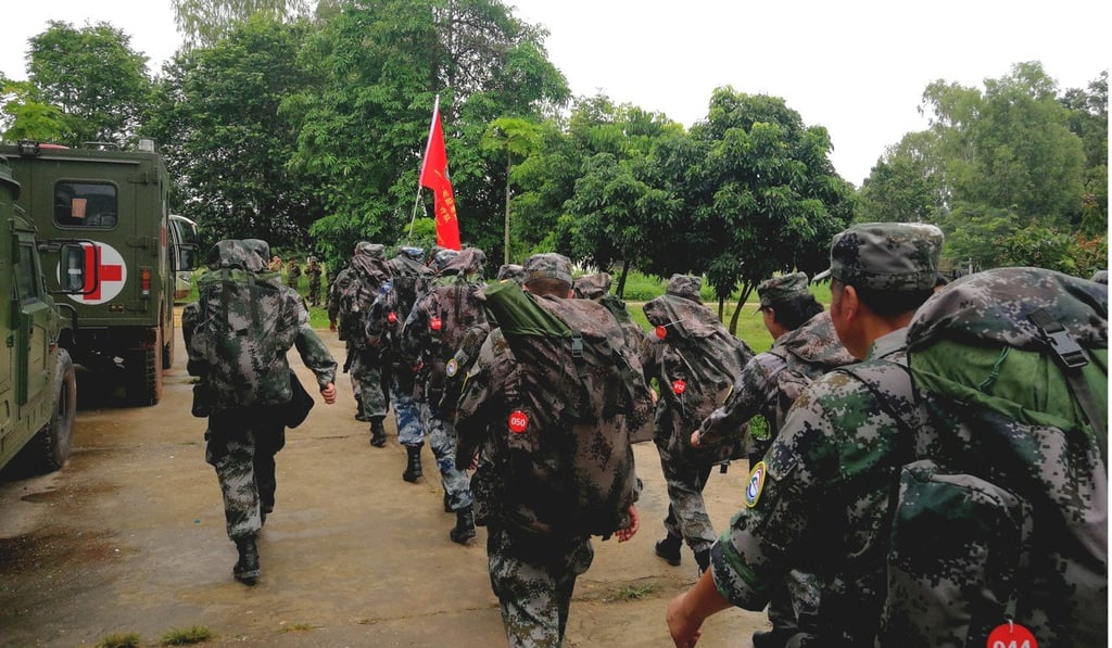 A Chinese People's Liberation Army (PLA) medical team leaves the Lao capital of Vientiane for Attapeu. Photo: Xinhua