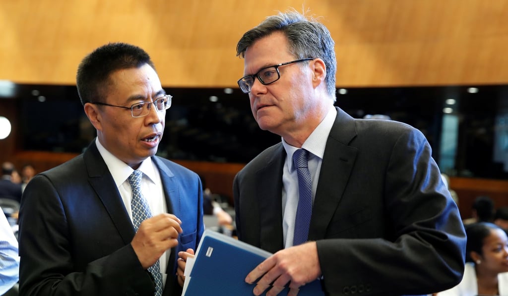 Dennis Shea (right), US Ambassador to the WTO, talks with Chinese counterpart Zhang Xiangchen before a meeting in Geneva, Switzerland, on Thursday. Photo: Reuters