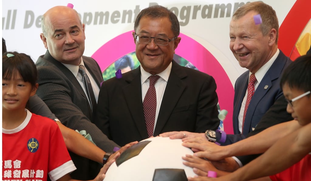 HKFA CEO Mark Sutcliffe (left) with HKFA chairman Brian Leung Hung-tak (Centre) and HKJC CEO Winfried Engelbrecht-Bresges as the five-year local football development plan is announced at Hong Kong Jockey Club.