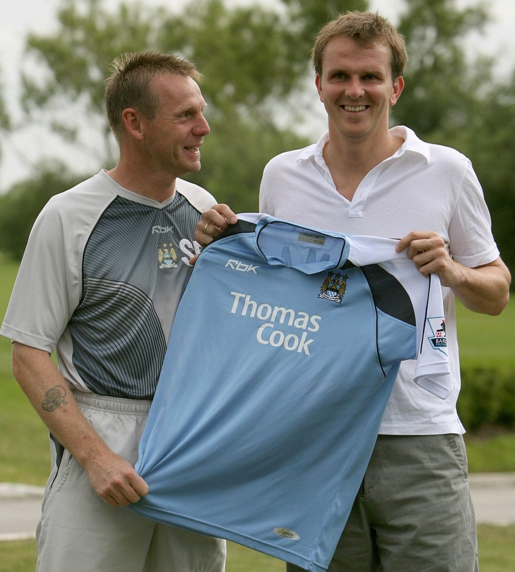 Dietmar Hamann (right) poses for photographers at Manchester City’s Carrington training ground with manager Stuart Pearce in July 2006. Photo: AP