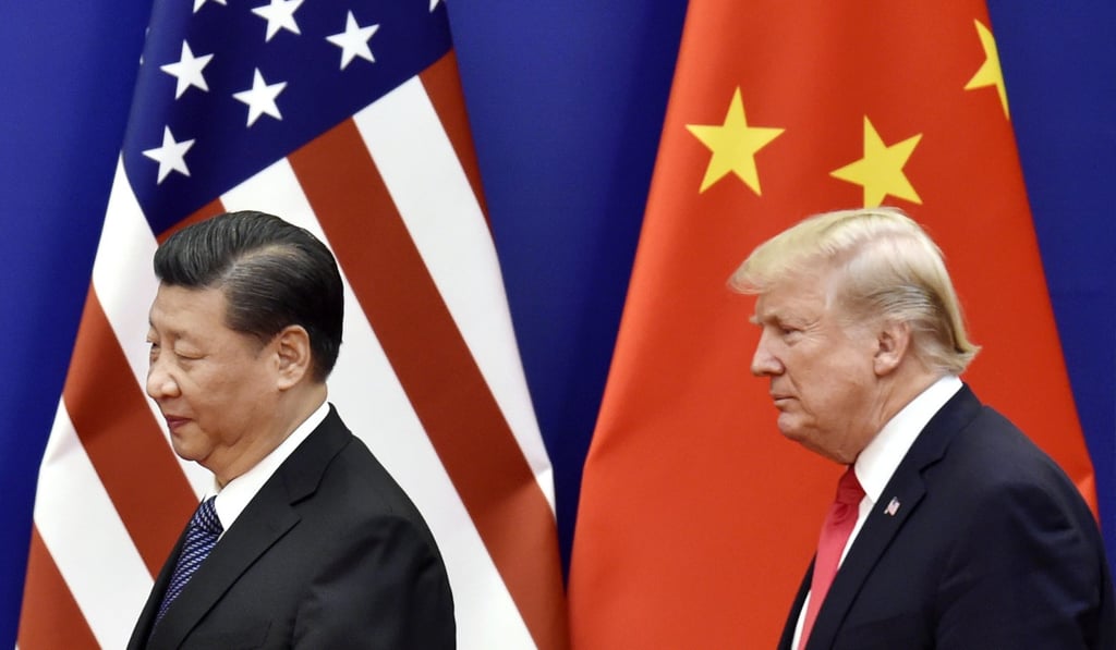Chinese President Xi Jinping and US President Donald Trump meet at the Great Hall of the People in Beijing. There are fears that China is using its yuan currency in its trade war with the US. Photo: Kyodo