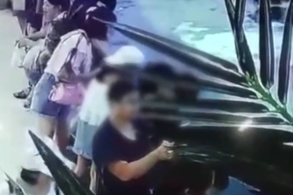 Visitors are seen around the open-top aquarium in the mall in this still from the video. Photo: Weibo