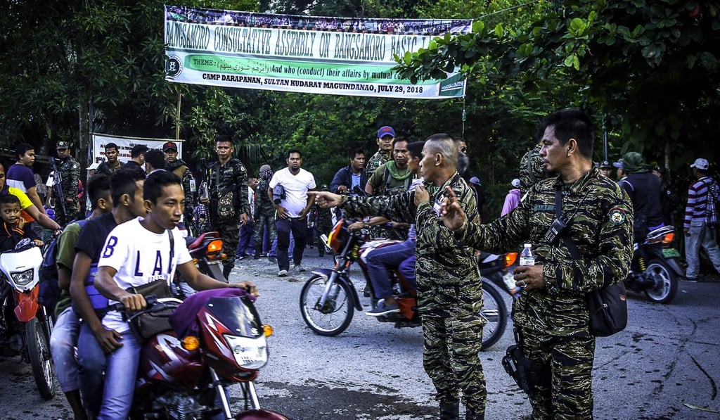 Moro Islamic Liberation Front (MILF) members secure Camp Darapanan in Sultan Kudarat, Maguindanao on the southern island of Mindanao. Photo: AFP