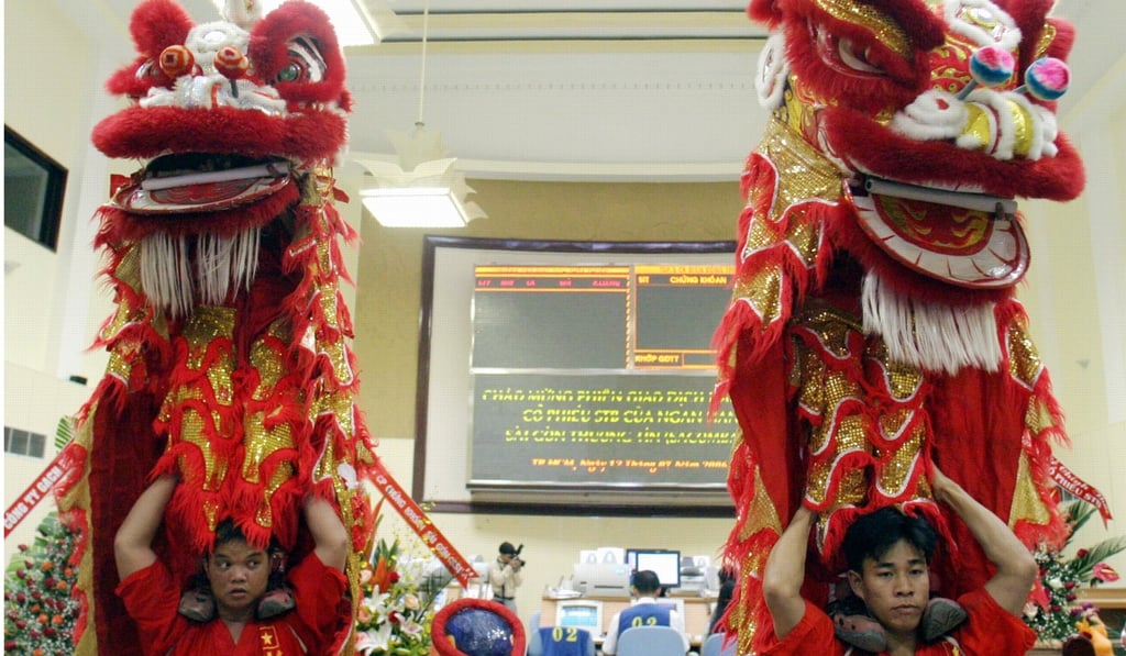 A dragon dance at the Securities Trading Centre in Ho Chi Minh. Photo: Reuters