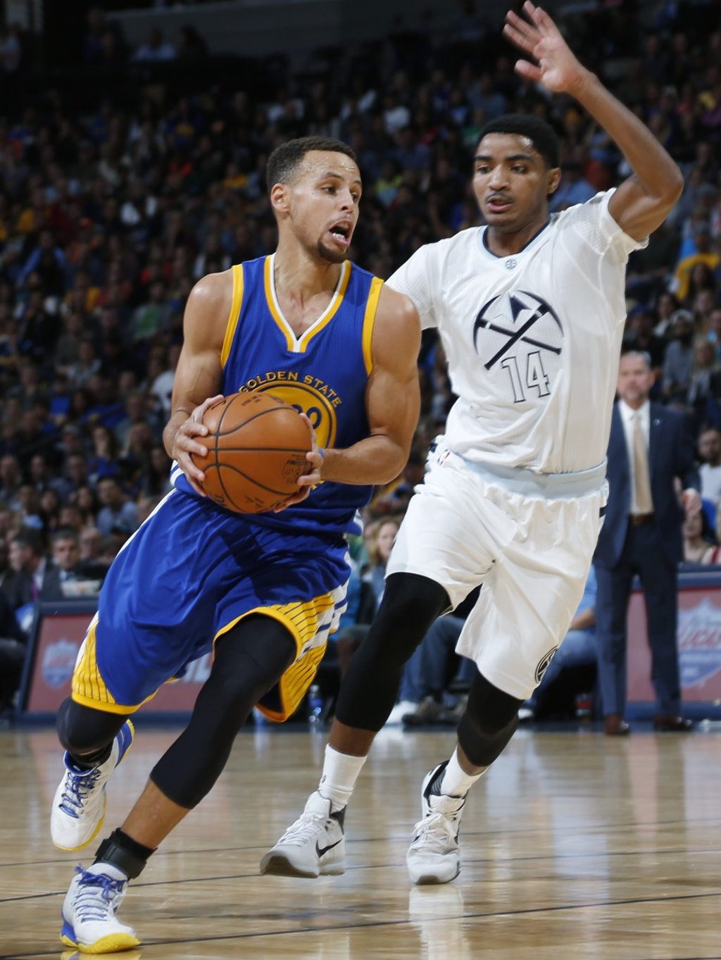 Stephen Curry (left) drives past Gary Harris in 2015. Photo: AP
