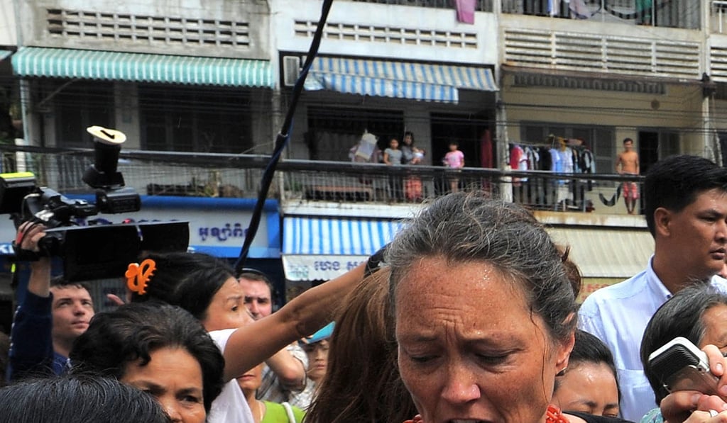 Cambodian police try to block Mo Sochua, centre, and her supporters on a street in Phnom Penh. Photo: AFP