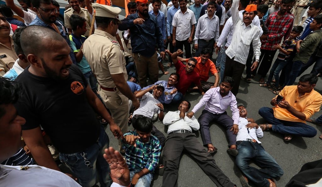 People from the Maratha community shout slogans as they block a motorway during a protest in Mumbai. Photo: EPA-EFE
