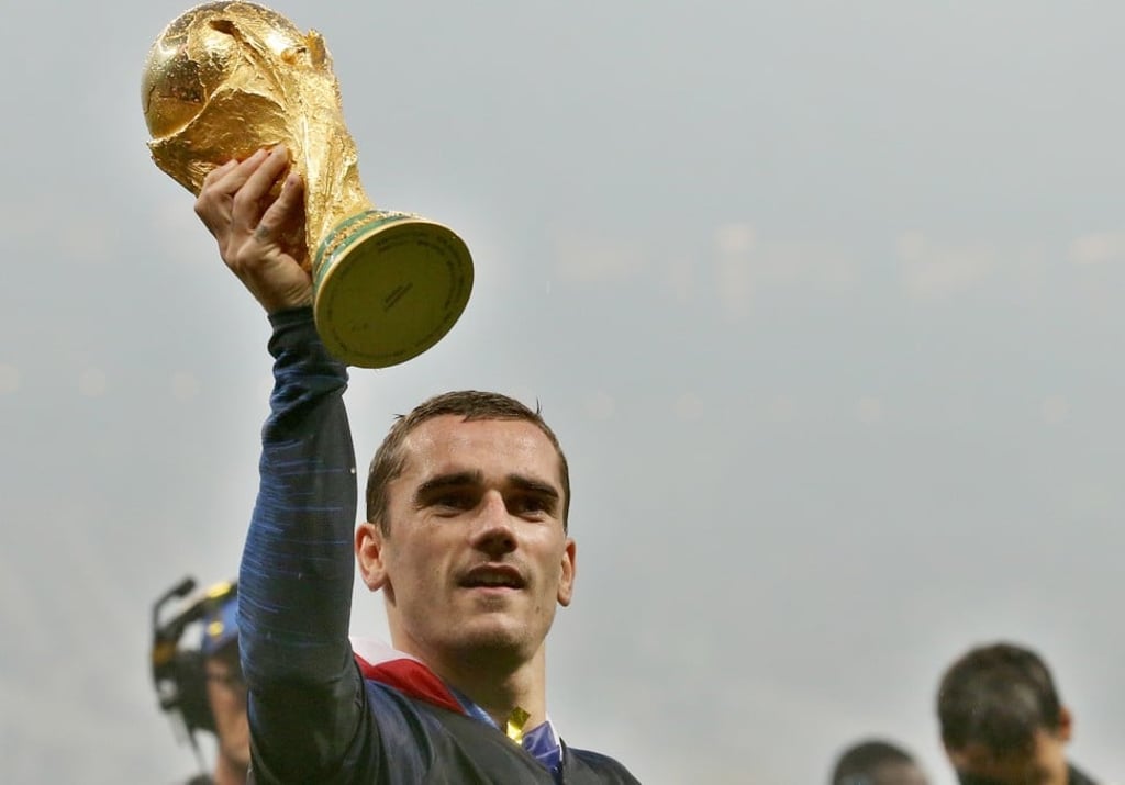 France international Antoine Griezmann holds up the World Cup trophy after his team beat Croatia 4-2 in the final in Russia on July 15. Photo: EPA-EFE