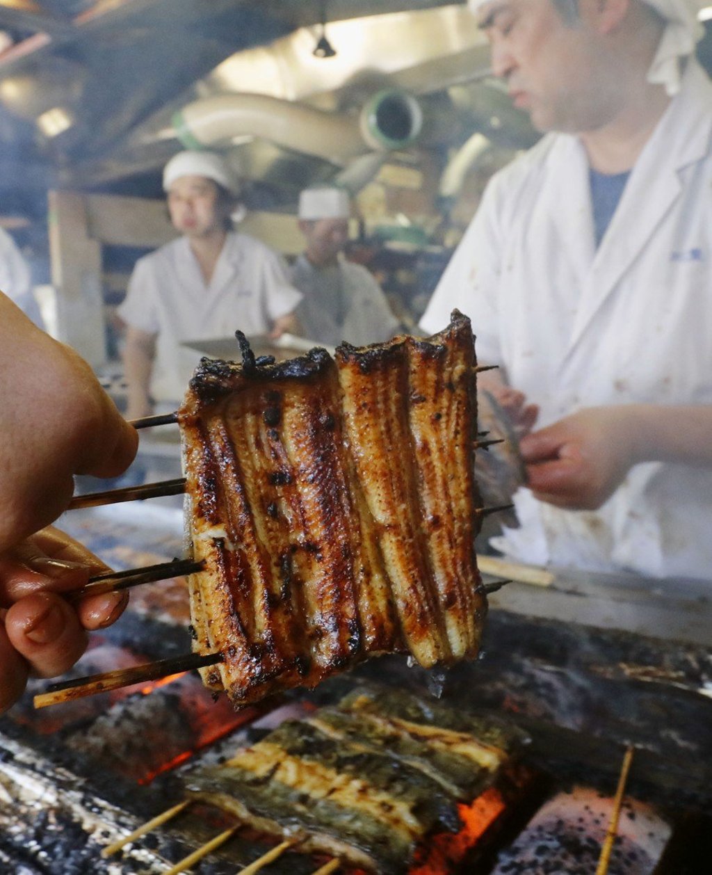 Eel being grilled at a restaurant in Narita, near Tokyo. Photo: Kyodo Eel being grilled at a restaurant in Narita, near Tokyo. Photo: Kyodo