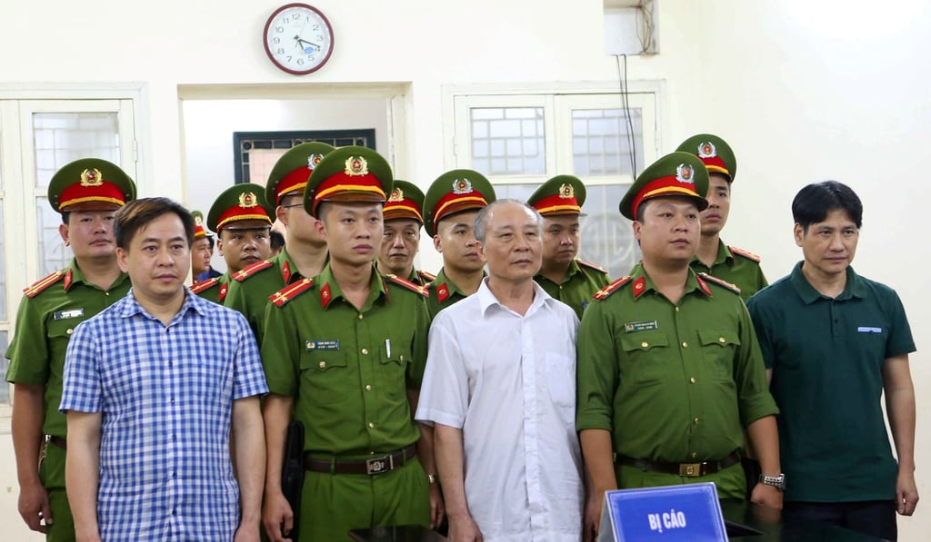 Phan Van Anh Vu (left), Phan Huu Tuan (centre) and Nguyen Huu Bach (right) listen during the verdict session of their trial on Monday in Hanoi. Photo: Doan Tan/VNA via Reuters