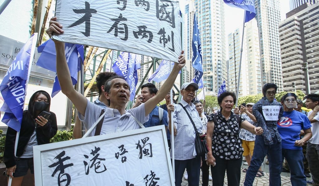 Activists protest the proposed ban on the party. Photo: Edmond So